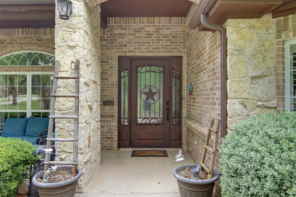 Beautiful entry with covered porch. Beautiful entry with covered porch.