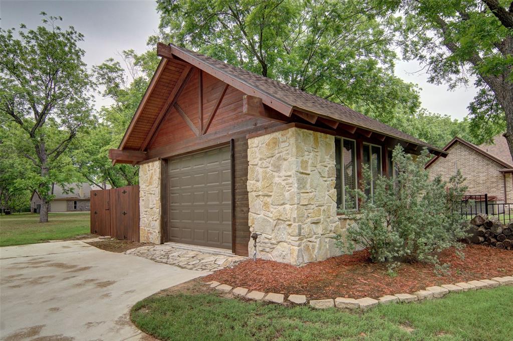 Additional view of workshop/detached garage with garage door.