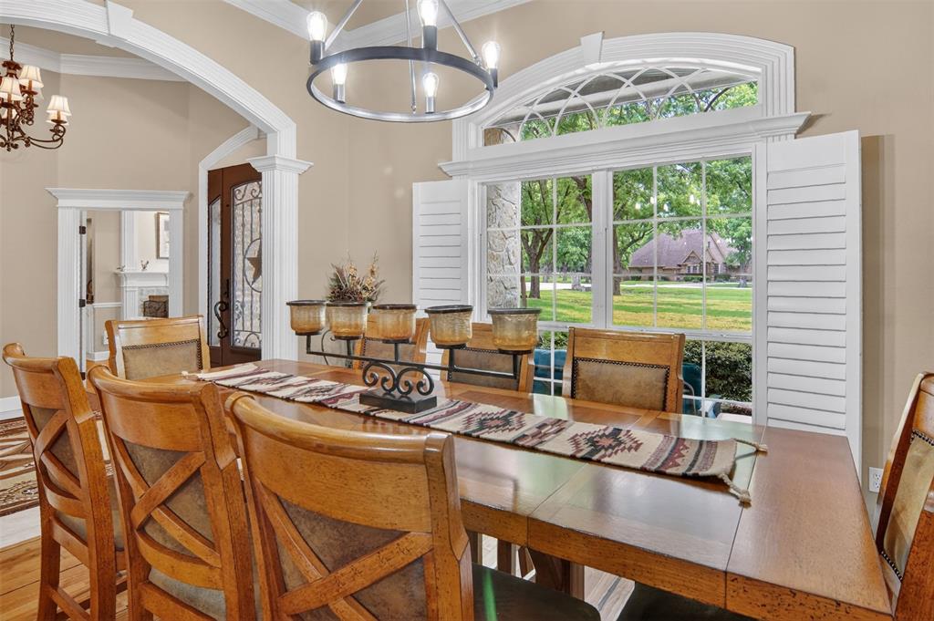 Additional view of dining room with large windows and view of front yard.