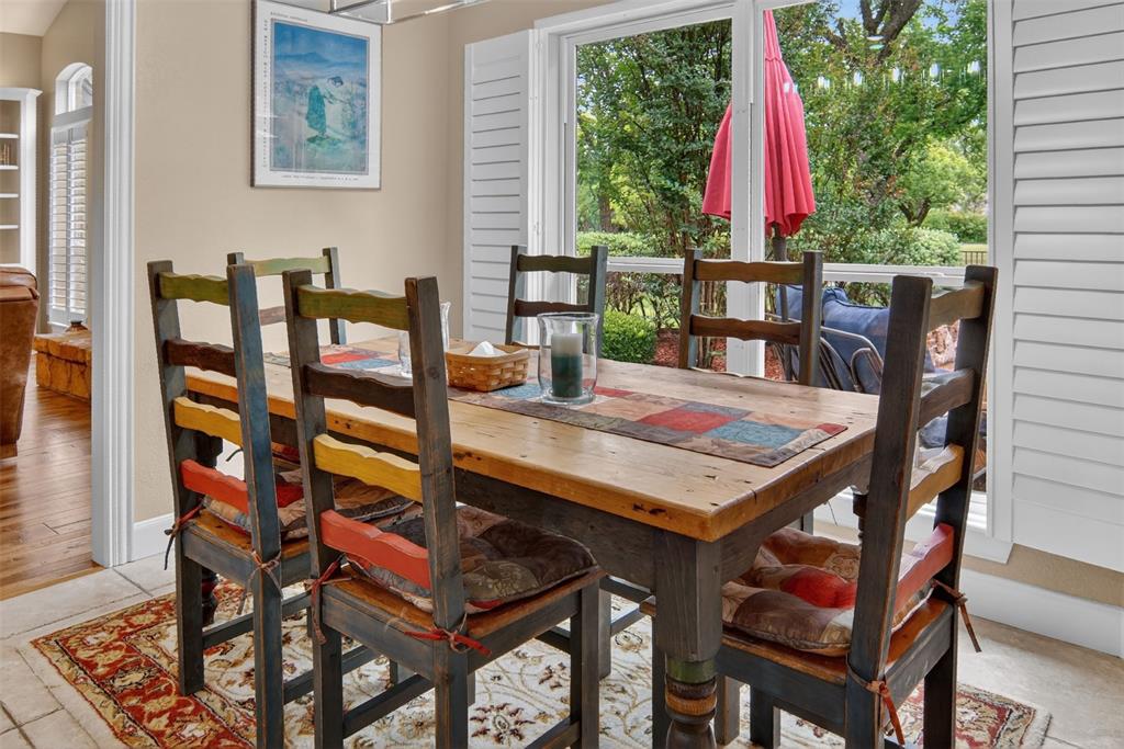Breakfast area with large windows and view of back yard.