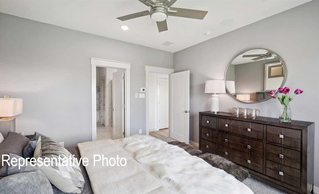 Interior room featuring light gray walls, a ceiling fan with integrated lighting, recessed lighting, and white trim