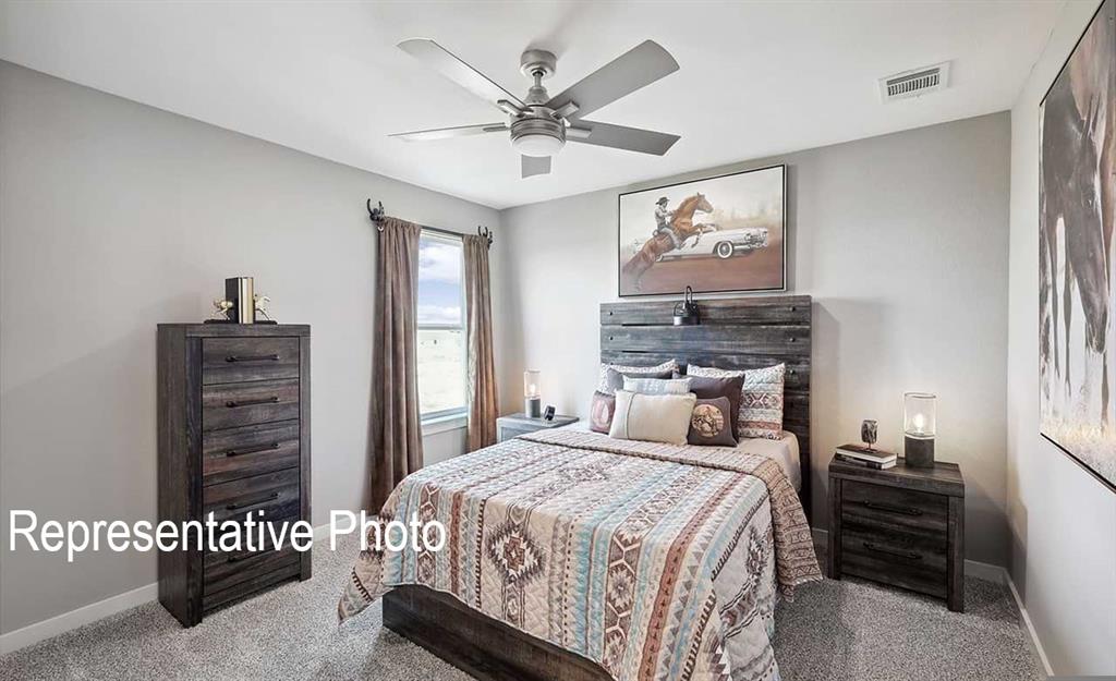 Neutral-toned walls complement the gray carpeting