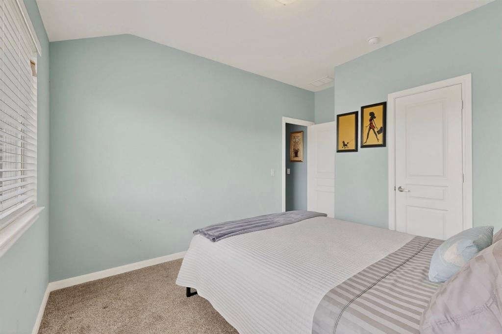 Neutral-toned carpeting and light blue walls create a serene atmosphere