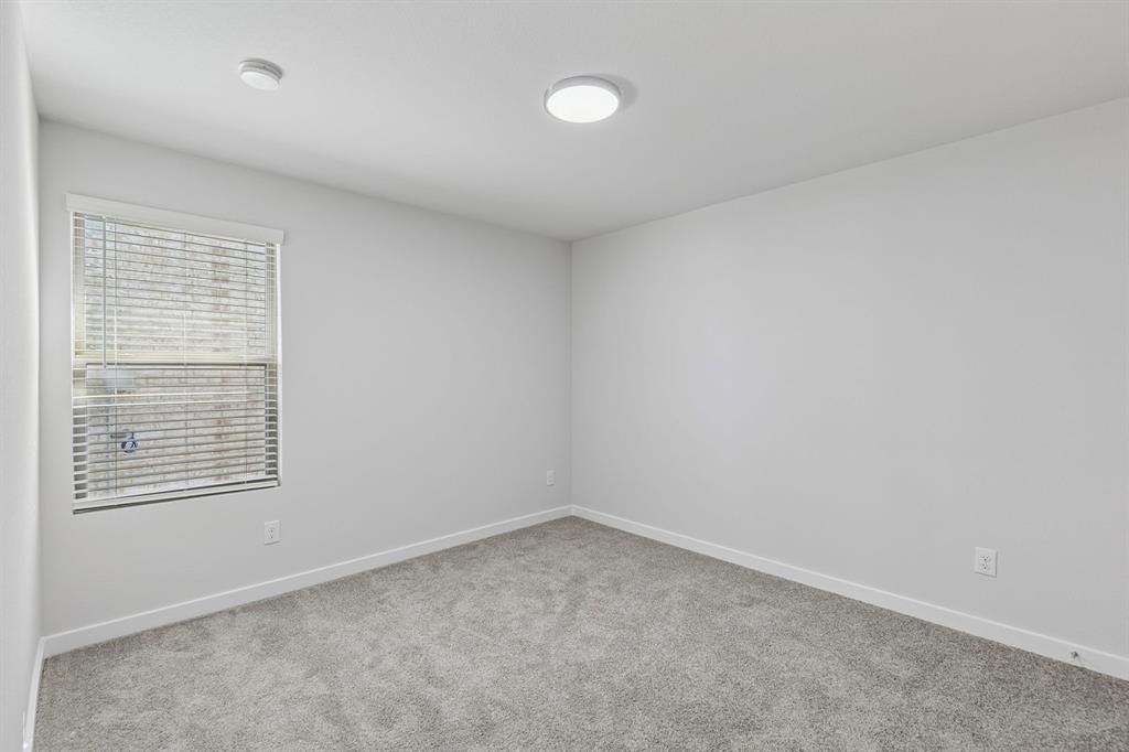 Bedroom in the Harrison home plan by Trophy Signature Homes – REPRESENTATIVE PHOTO