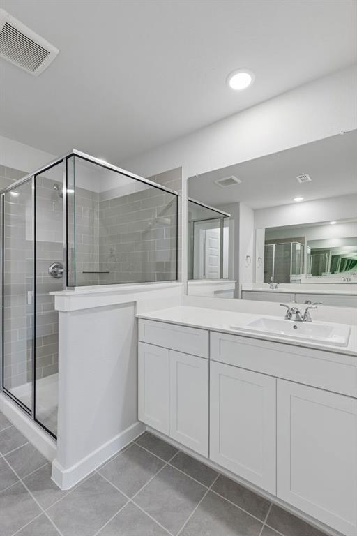Primary Bathroom in the Harrison home plan by Trophy Signature Homes – REPRESENTATIVE PHOTO