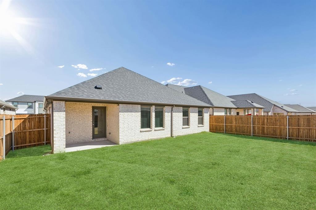 Covered Patio in the Harrison home plan by Trophy Signature Homes – REPRESENTATIVE PHOTO