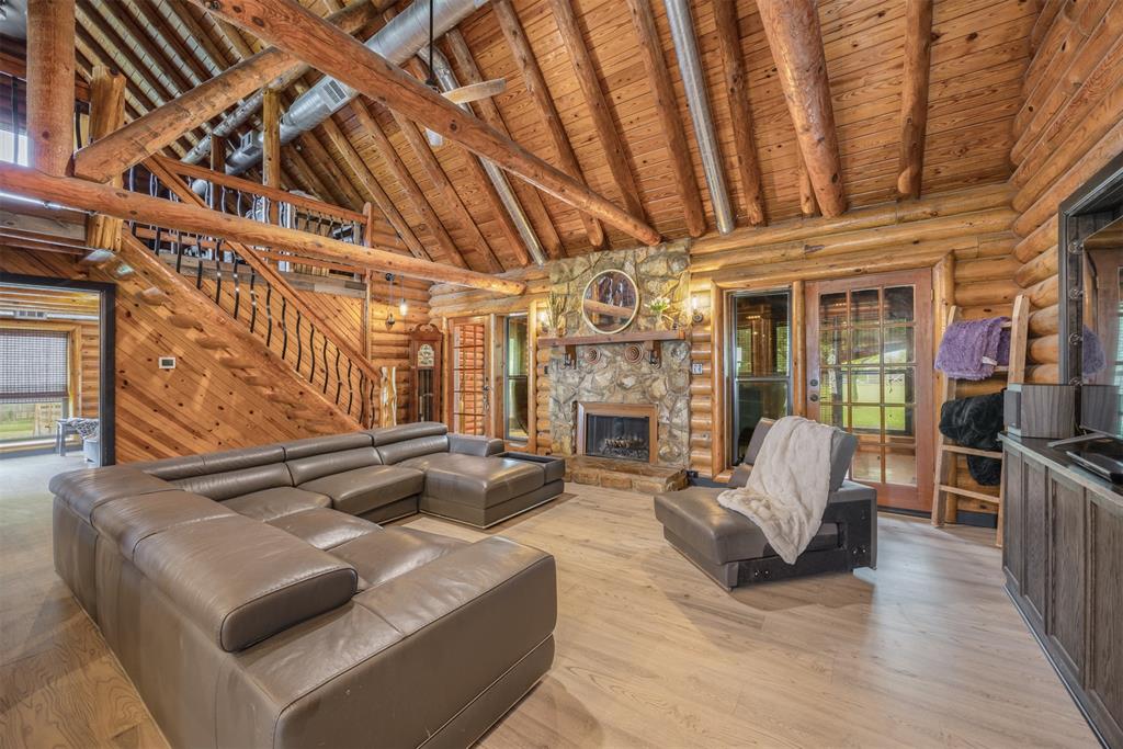 Spacious living area with high ceilings and exposed beams