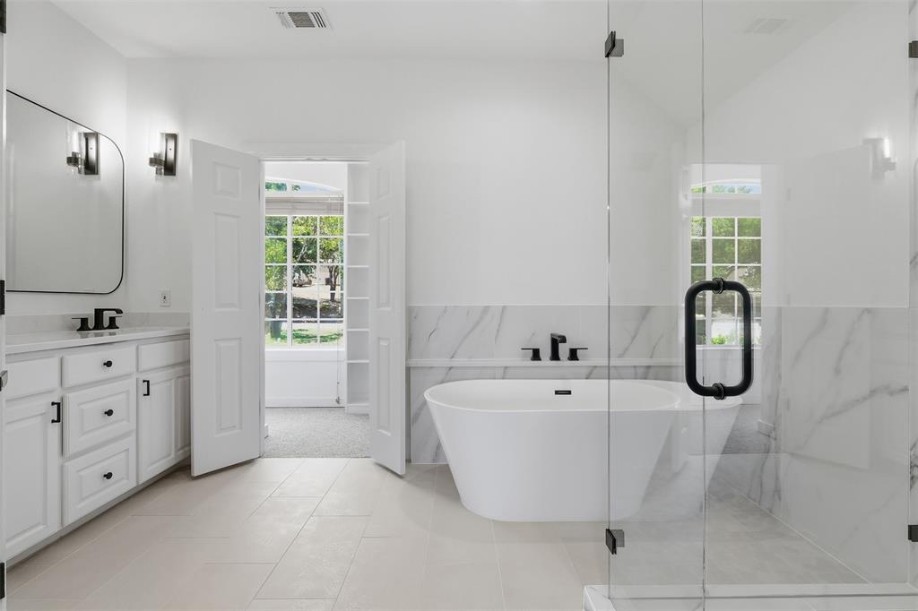 Primary bathroom #2 leading into master closet and private laundry