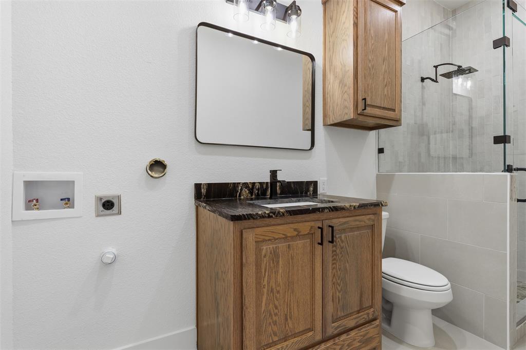 full bathroom with laundry