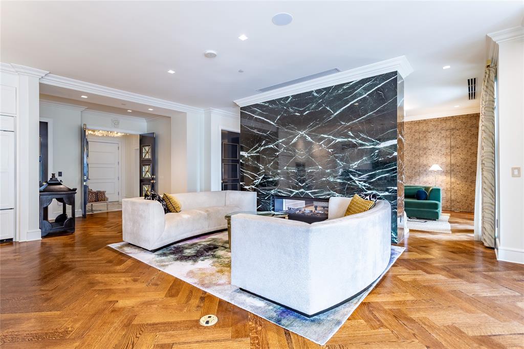 Open Living with see-through Fireplace.