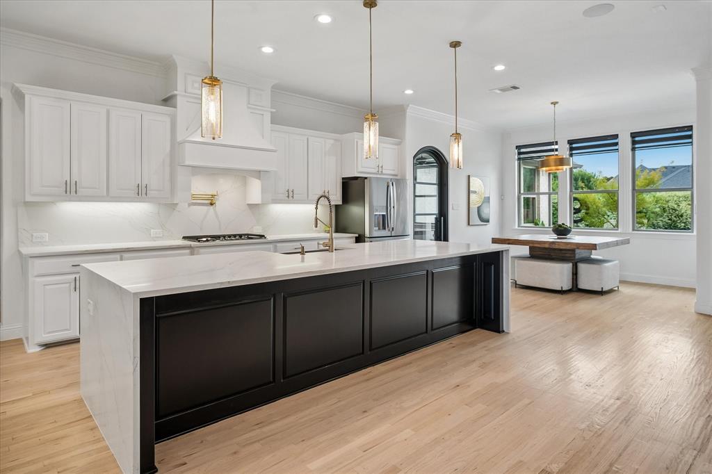 Huge Island with Waterfall Countertops Huge Island with Waterfall Countertops