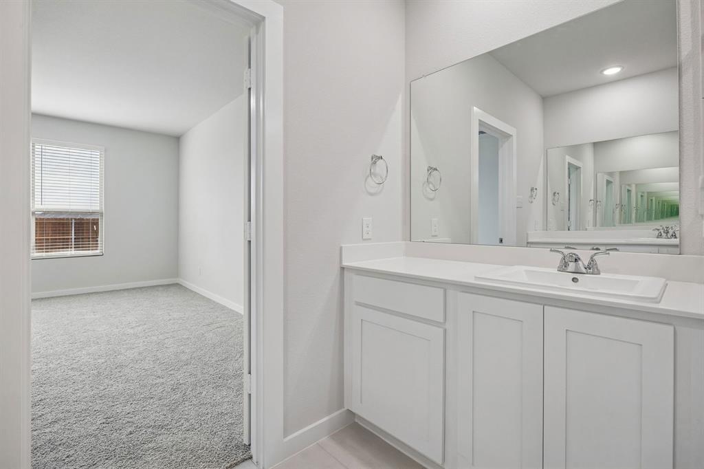 Primary Bathroom in the Masters home plan by Trophy Signature Homes – REPRESENTATIVE PHOTO
