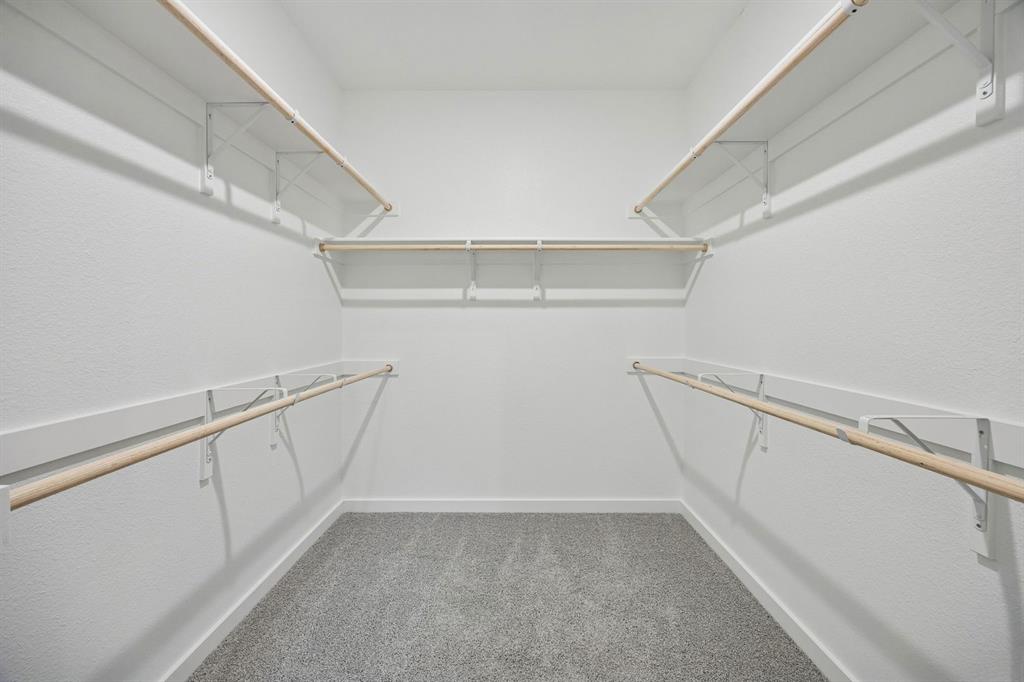 Primary Closet in the Masters home plan by Trophy Signature Homes – REPRESENTATIVE PHOTO