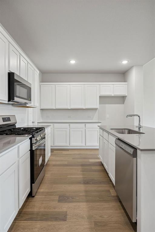 Kitchen in the Masters home plan by Trophy Signature Homes – REPRESENTATIVE PHOTO