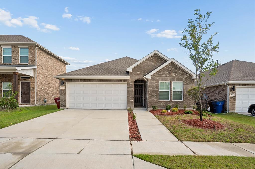 Single-story brick exterior with an attached two-car garage Single-story brick exterior with an attached two-car garage