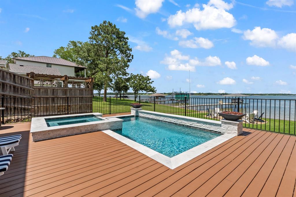 Expansive composite deck surround plus wrought iron fencing.
