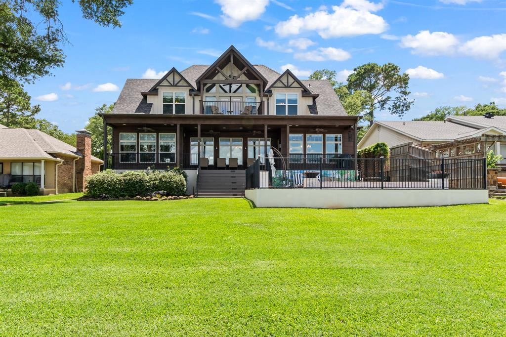 Spacious .38-acre lot with 80 ft of platted waterfront, LED Lighting on the boathouse, and waterside firepit.