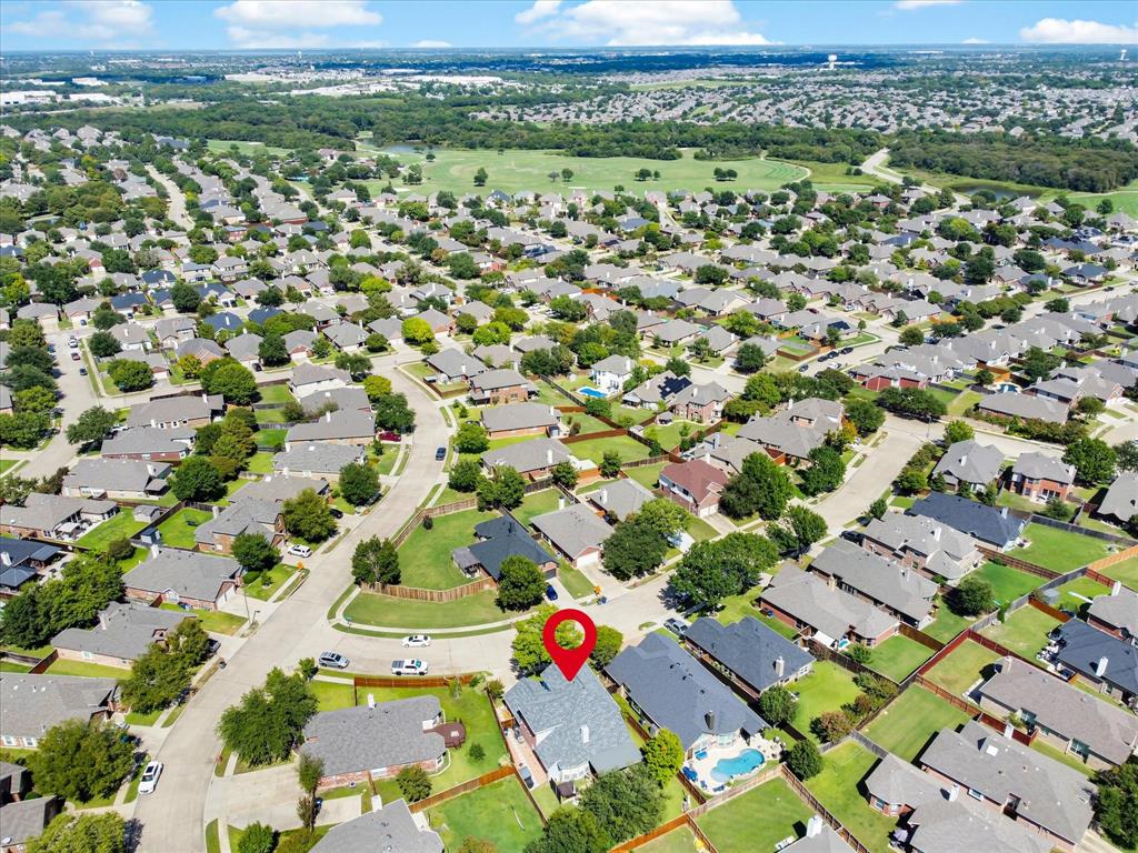 Aerial overview of a residential neighborhood with numerous single-family homes