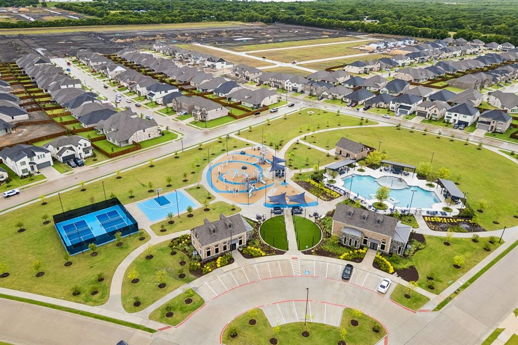 Community center with pickleball courts, basketball court, playground, community pool, and club house