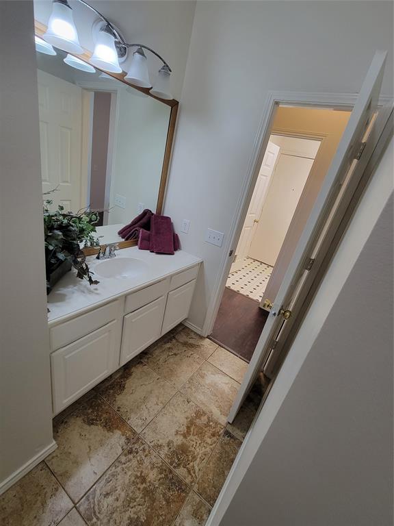 Full bathroom with vanity, tiled shower / bath, toilet, and tile flooring