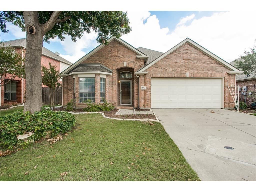 Front of home with front entry garage and large tree Front of home with front entry garage and large tree