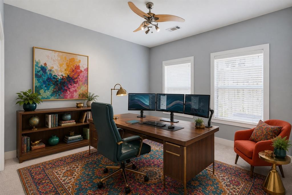 Room featuring two windows with blinds, a ceiling fan with integrated lighting, and a built-in bookshelf