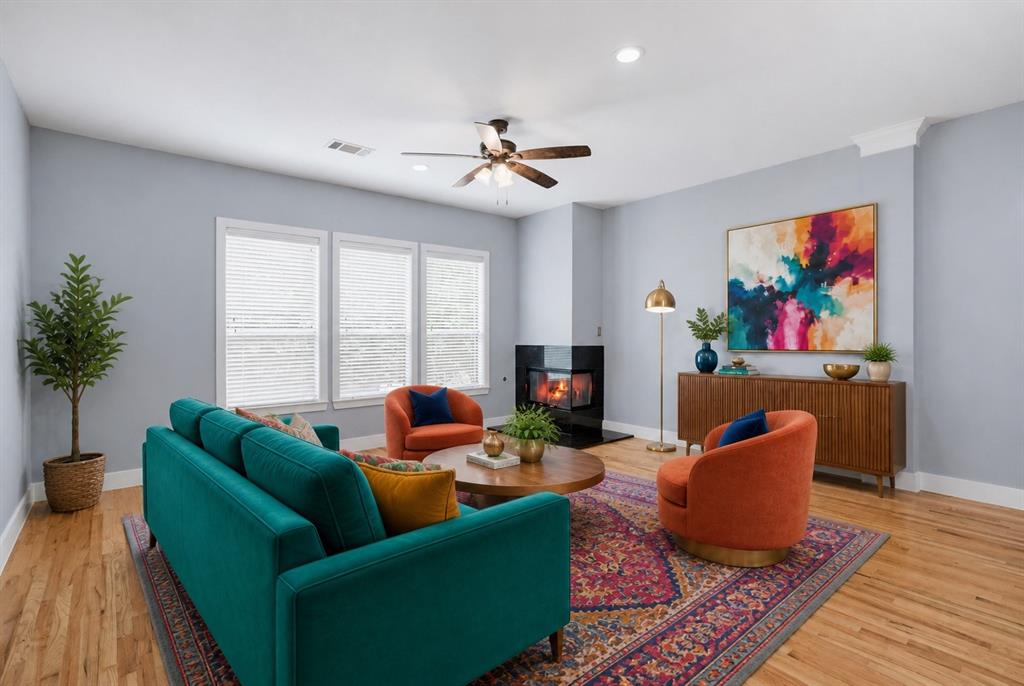 Hardwood flooring throughout, recessed lighting, and a ceiling fan Hardwood flooring throughout, recessed lighting, and a ceiling fan