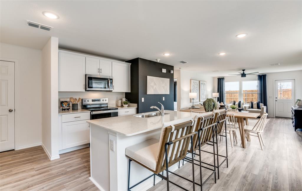 *Model Representation - Large island overlooking gathering room and dining areas *Model Representation - Large island overlooking gathering room and dining areas