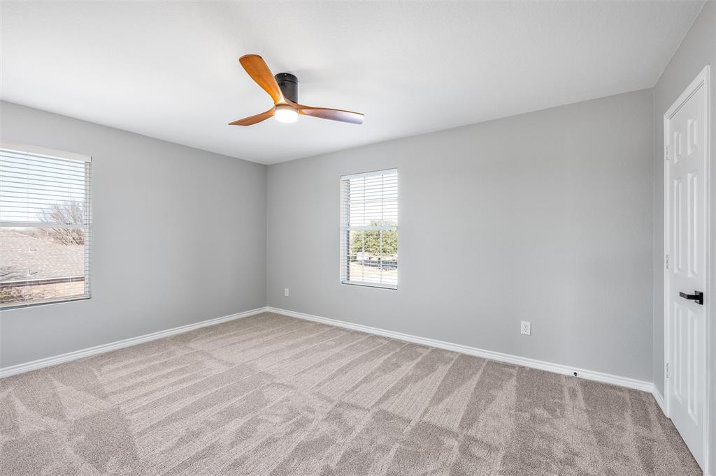 Upstairs Bedroom #2 with walk in closet, new carpet and ceiling fan