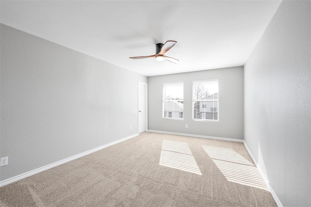 Upstairs Bedroom #4 with walk in closet, new carpet and ceiling fan