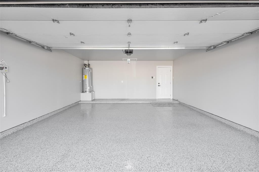 New epoxy floors, insulated garage door, new opener and new water heater