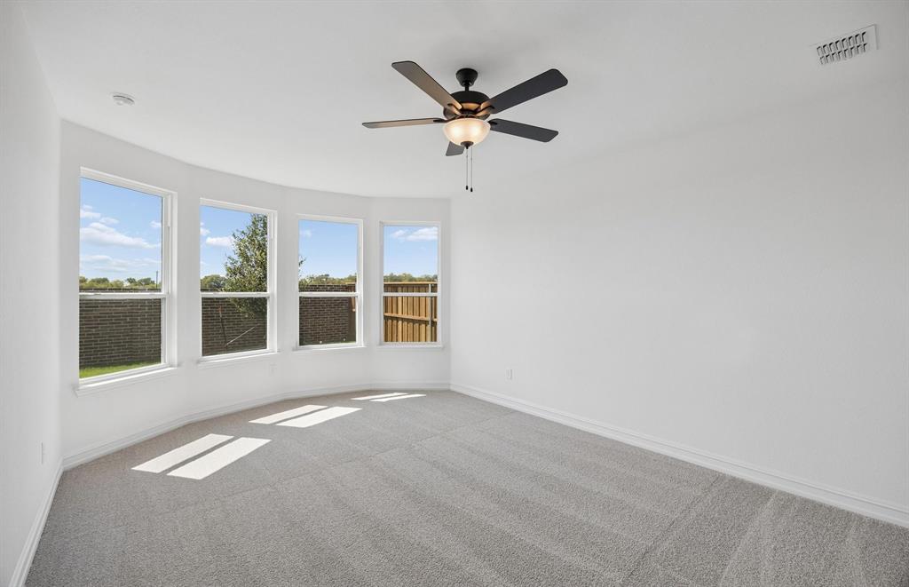 Primary bedroom with bay windows