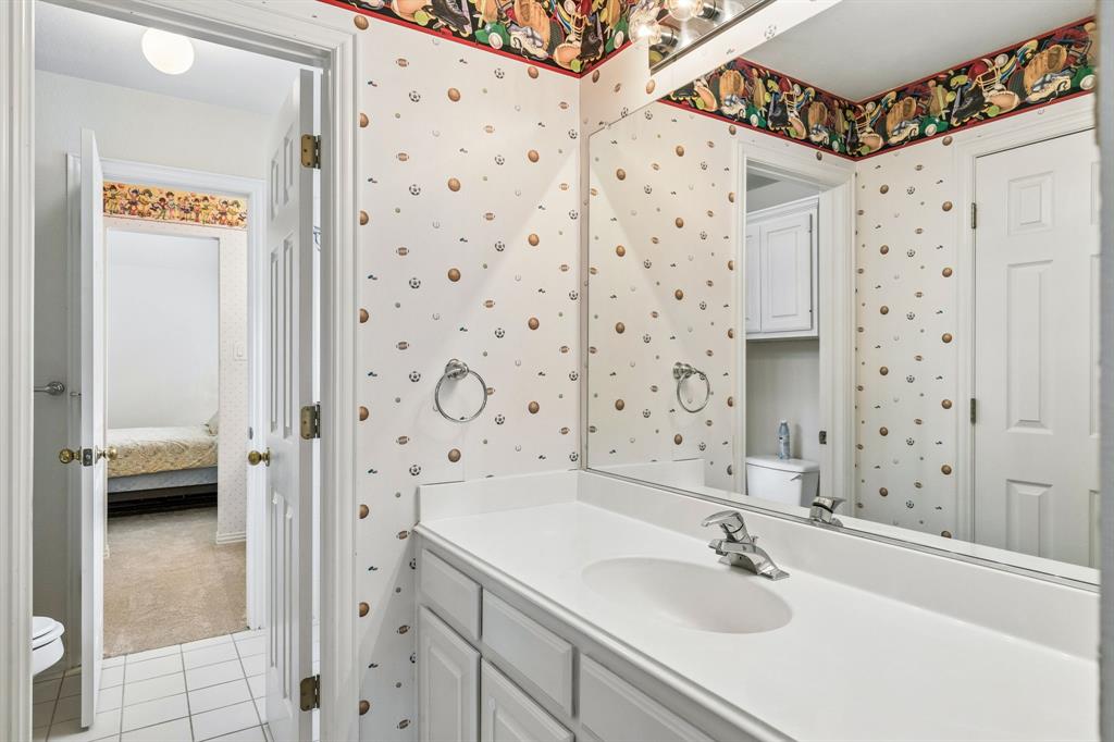 Featuring a tub and shower combination perfect for a relaxing soak or a quick rinse, plus a vanity with ample cabinet storage to keep all your essentials neatly tucked away.