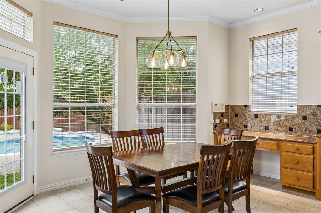 The large kitchen opens to the breakfast room and living room where the chef will still be able to enjoy and interact with family and friends while meals are being prepared for everyone. Here a window, there a window!