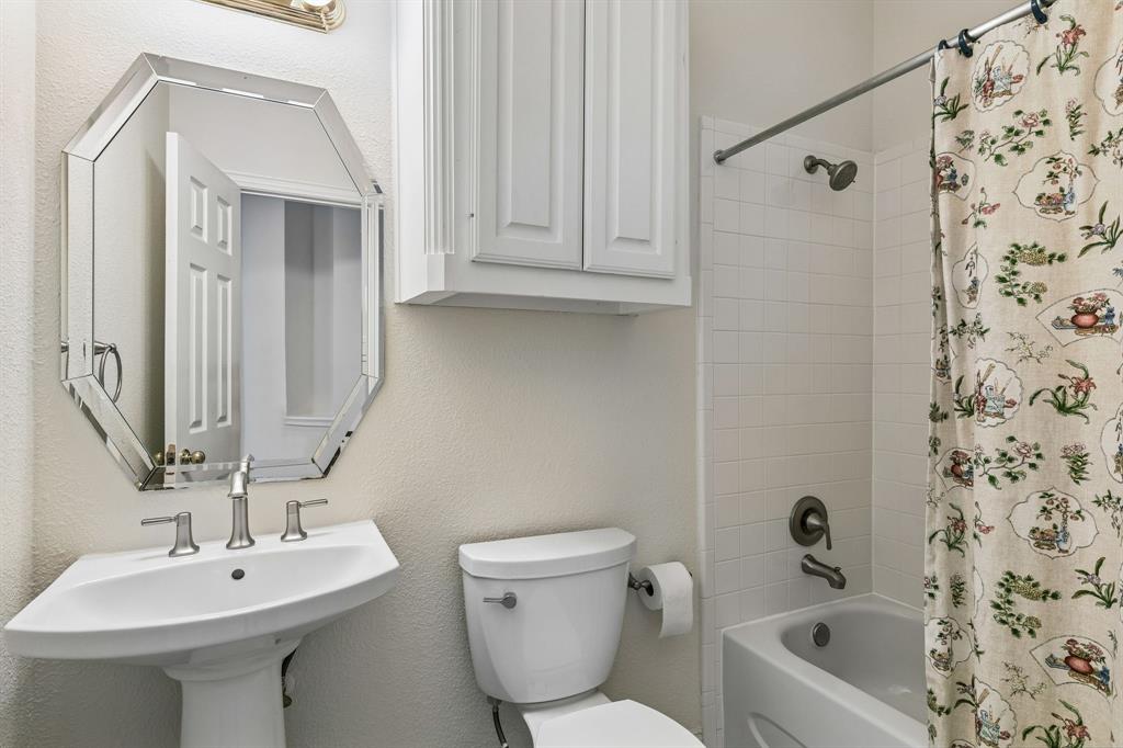Whether it's bubble baths, bedtime routines, or getting ready for the day ahead, this full bathroom is ready for it all! Complete with a tub-shower combo, spacious vanity, toilet, and plenty of storage cabinetry.
