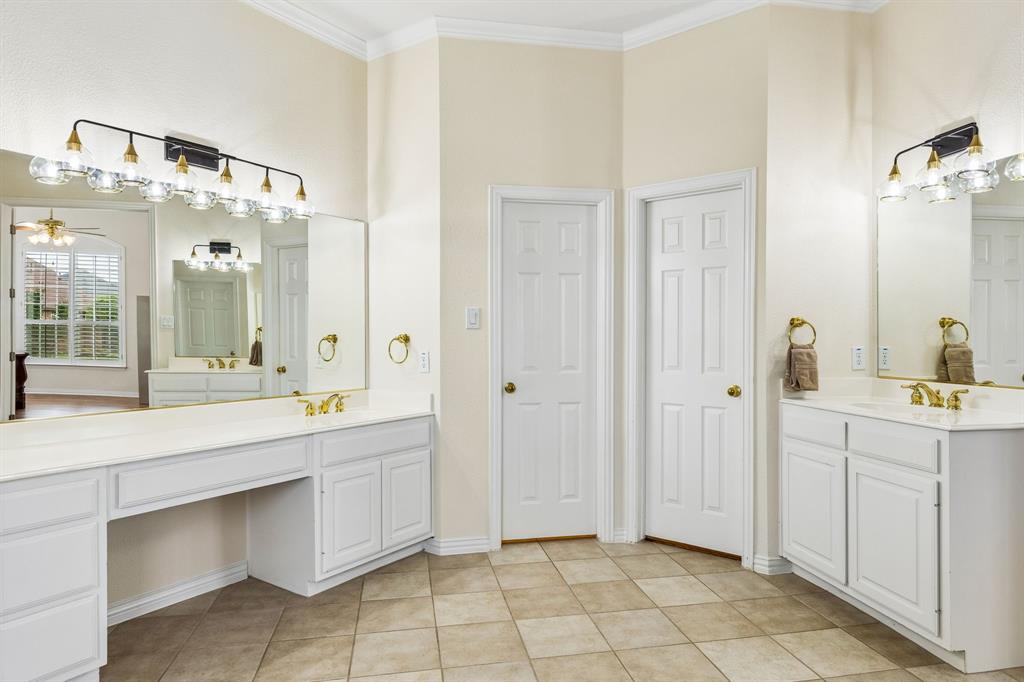 Separate vanity areas provide plenty of personal space for busy mornings, while dual walk-in closets offer exceptional storage and organization. Unwind after a long day in the relaxing jetted Jacuzzi tub or enjoy the convenience of the separate walk-in shower. Combining comfort, space, and everyday practicality.