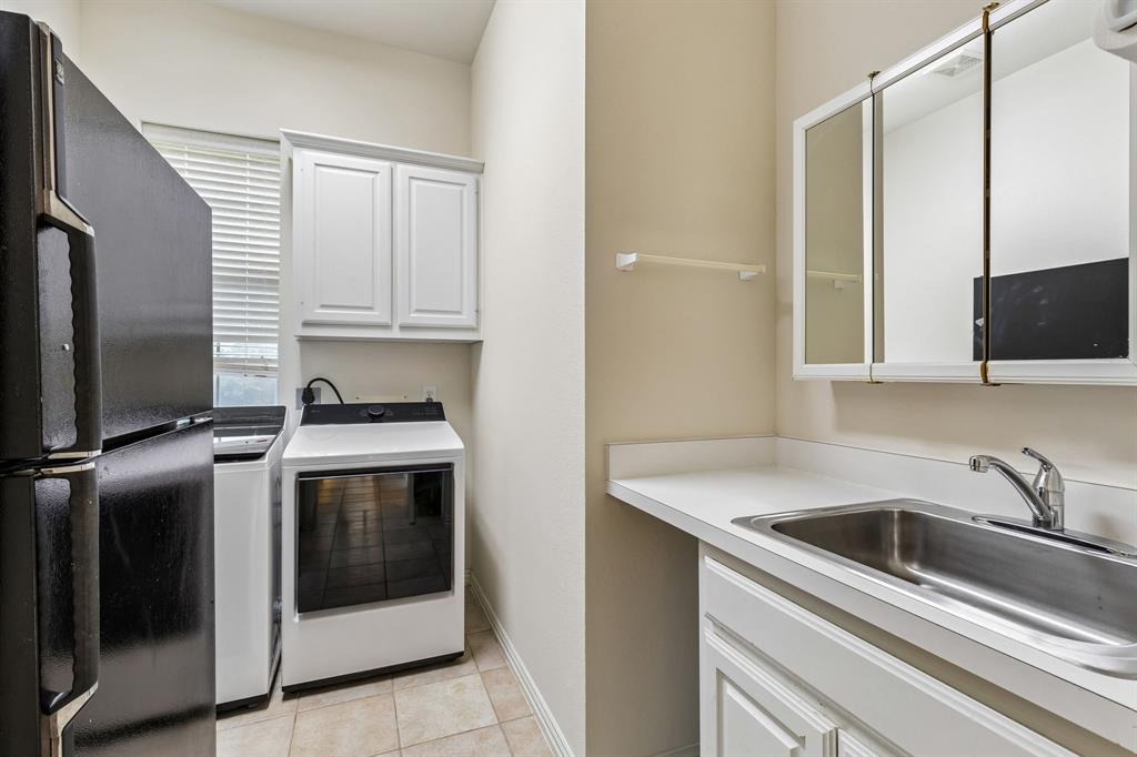 The laundry room everyone loves. Room for washer, dryer and an extra fridge. Sink and abundant cabinetry included. Oh yeah!!