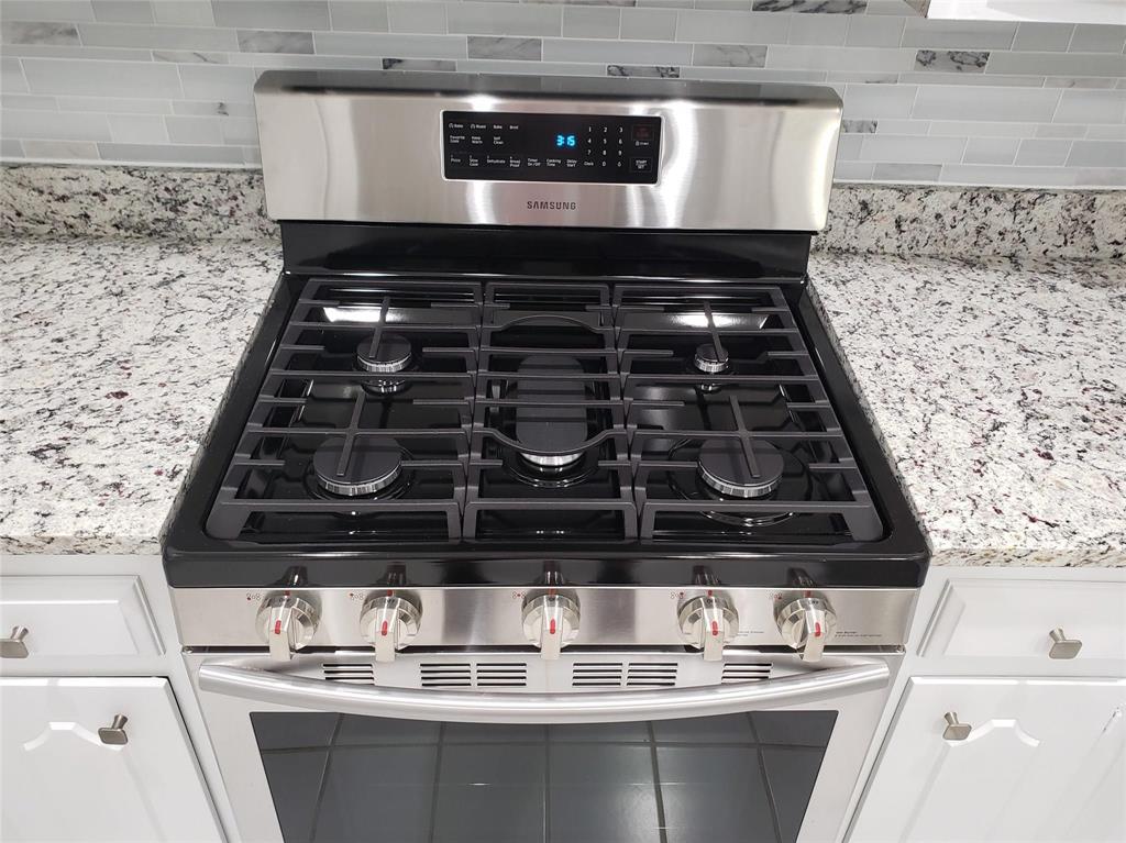 Gas stovetop with a convection oven.