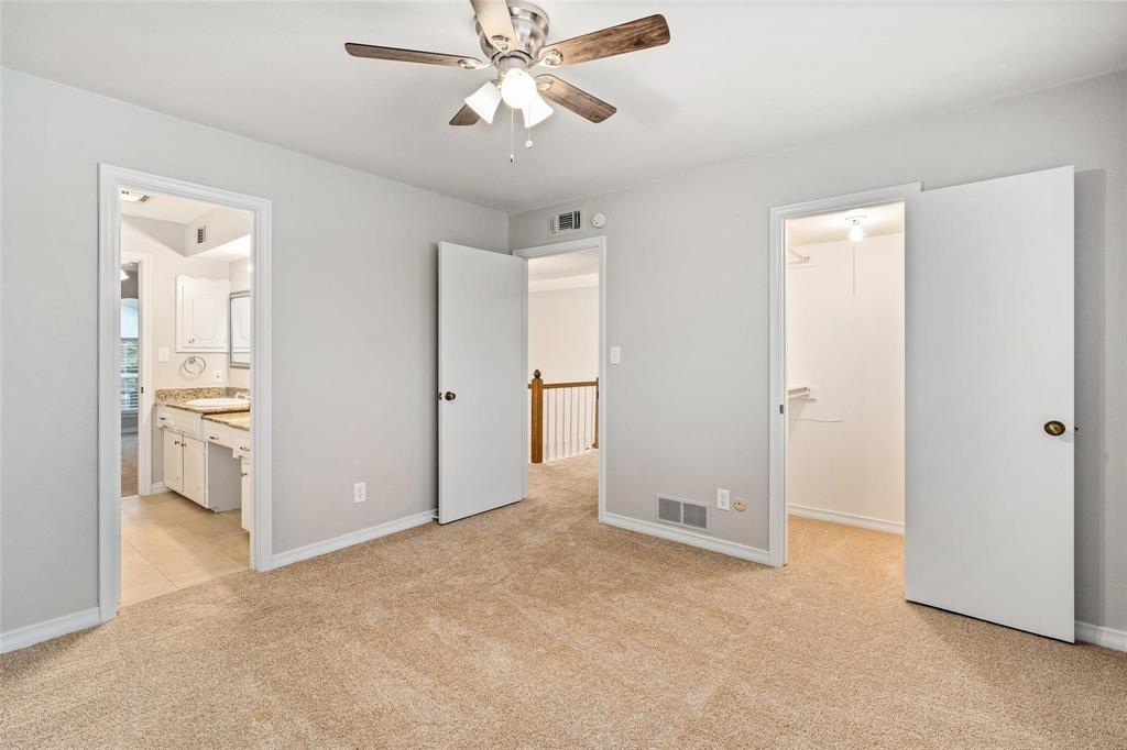 One of the two Guest bedrooms upstairs with Jack and Jill bath between them.