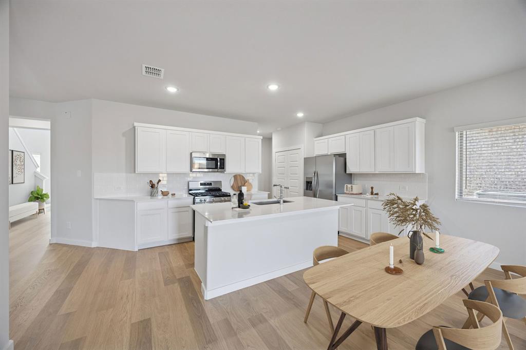 Kitchen in the Oak II home plan by Trophy Signature Homes – REPRESENTATIVE PHOTO