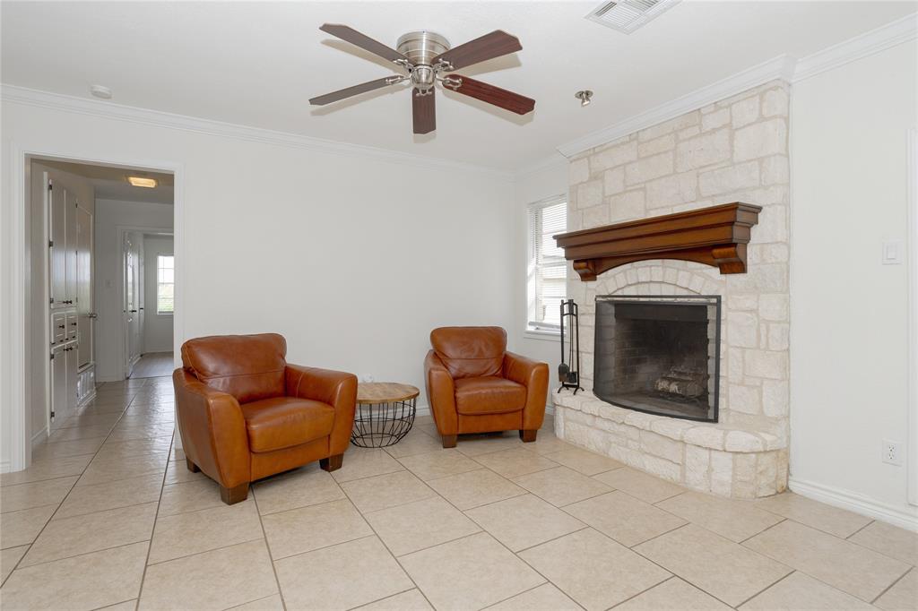 Another view of the living area, with wood burning fireplace.