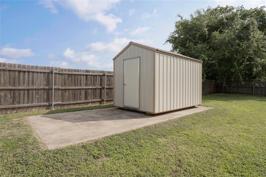 8' X 12' Storage shed, on a concrete pad, in the backyard.
