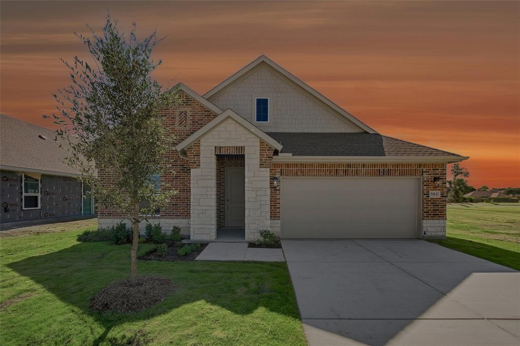 Brick and stone veneer exterior with a covered entry