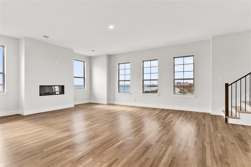 Built in fireplace, wall of windows viewing lake Built in fireplace, wall of windows viewing lake