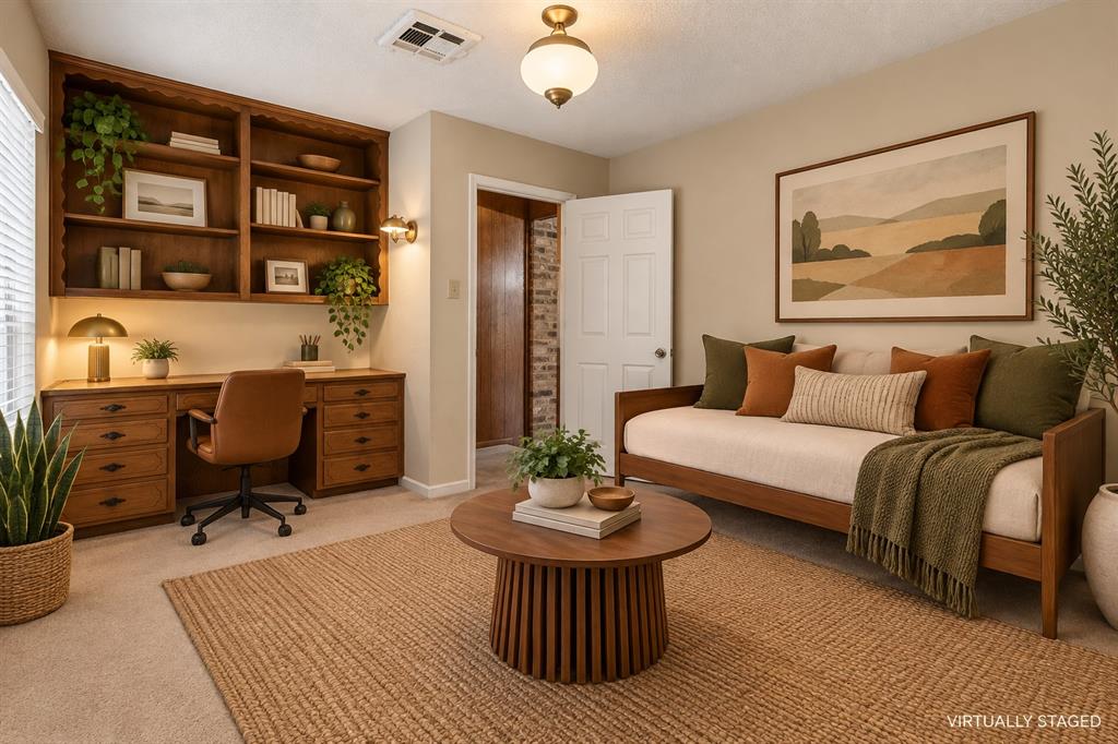 Built-in wood shelving and desk unit, wall-mounted light fixture, recessed ceiling light, and ceiling-mounted light fixture