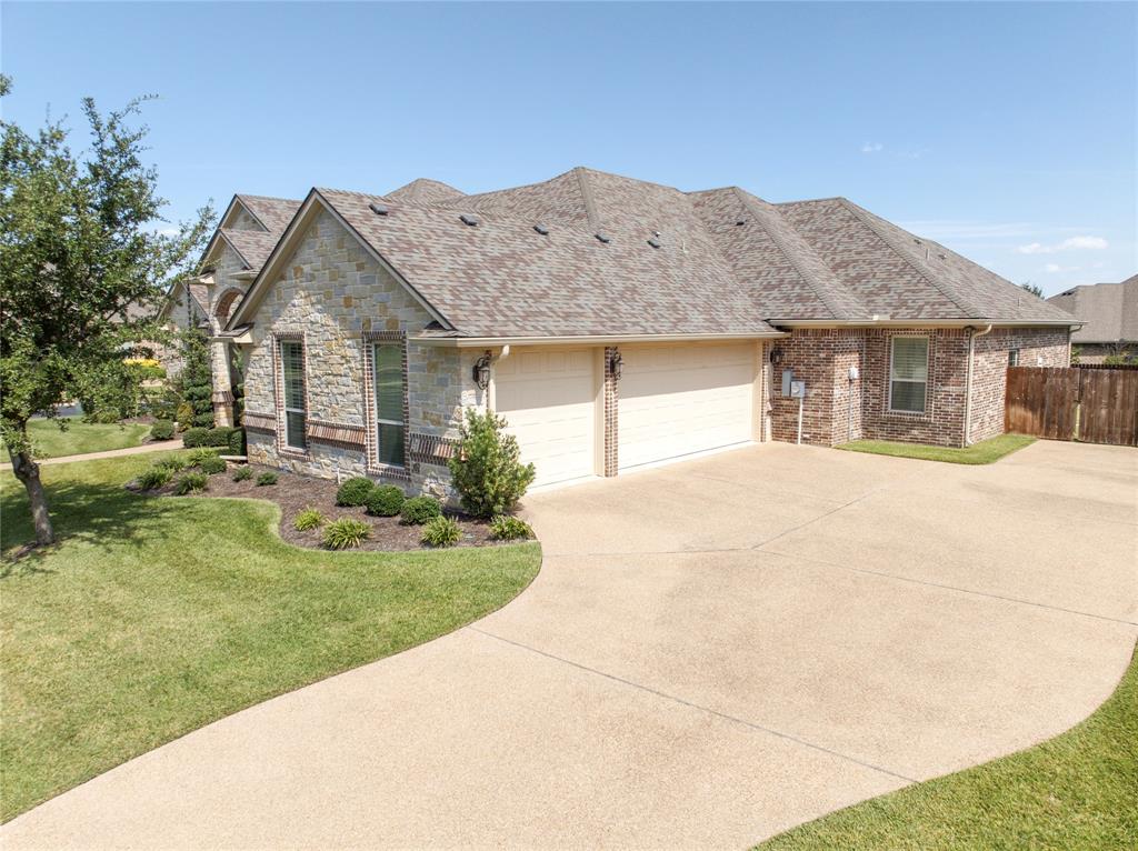 Stone and brick facade with a two-car garage