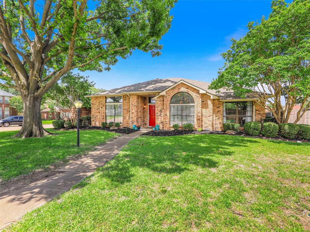 This large corner lot features mature trees and landscaping. This large corner lot features mature trees and landscaping.