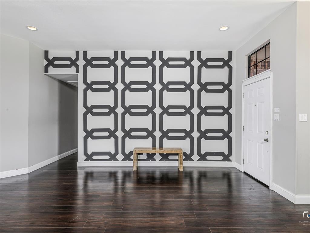 As you enter the home through the front door, note the feature wall and beautiful wood floors. As you enter the home through the front door, note the feature wall and beautiful wood floors.