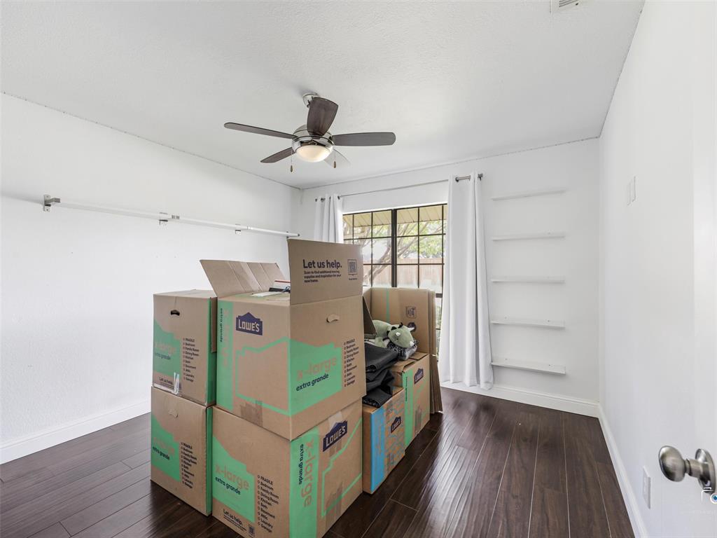 Bedroom 4 has the same wood floors and made a perfect home office for the current homeowner.  It is currently all packed up and ready to move!