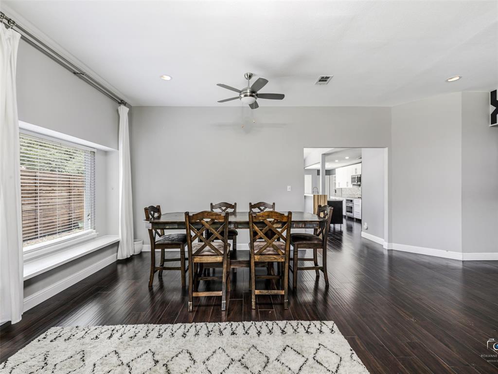 The dining room features a window seat window and opens to the kitchen. The dining room features a window seat window and opens to the kitchen.